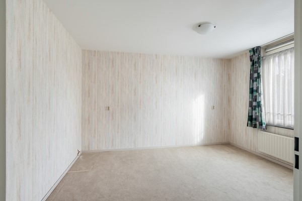 Foto - Te koop: Ruime dubbele benedenwoning met parkeerplaats!